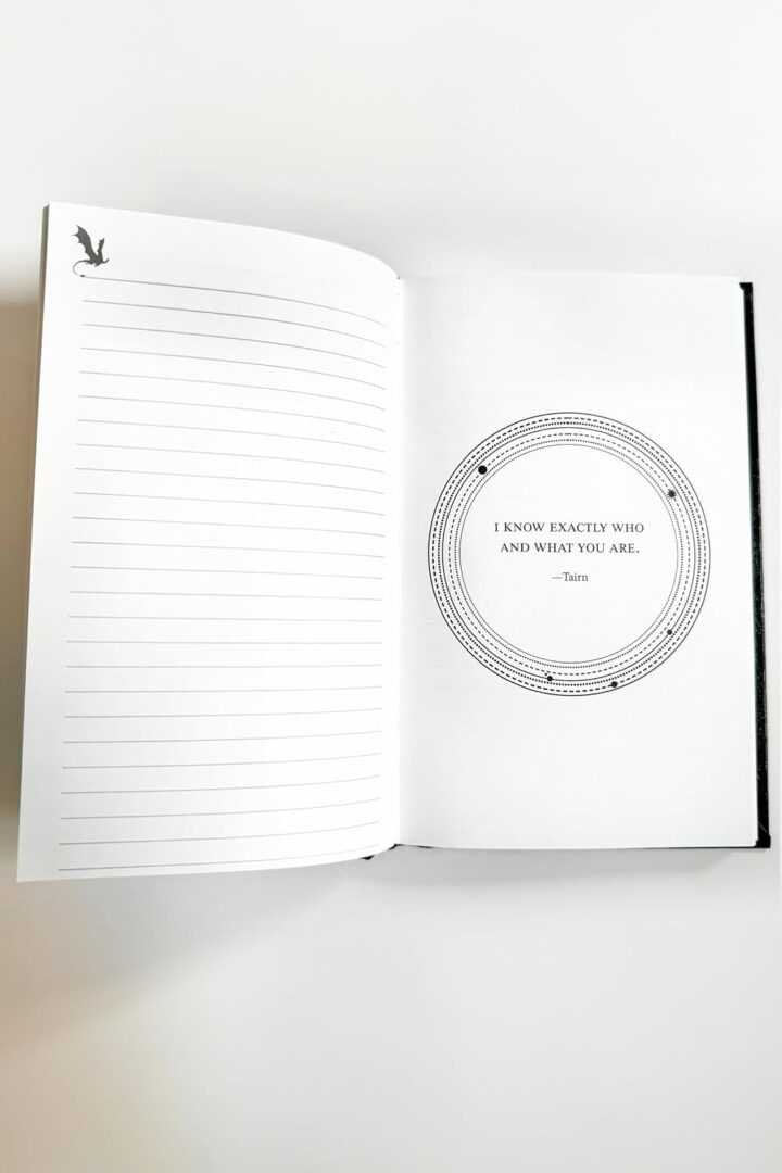 The Official Fourth Wing Journal: Violent Little Thing Edition by Rebecca Yarros features lined pages on the left and a circular design with the quote, "I know exactly who and what you are."—Tatum, on the right. A small bird silhouette sits atop the left page.