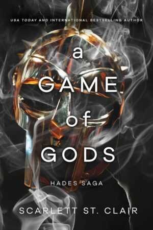 A cracked bronze or gold helmet with plume sits against a smoky black background. Text: A Game of Gods by Scarlett St. Clair (Hades x Persephone Saga, 6 of 7), Bestselling Paperback Romance Novel.