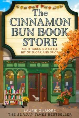 The illustrated cover of The Cinnamon Bun Book Store by Laurie Gilmore (Dream Harbor, 2 of 6) shows a green storefront with autumn leaves, bunting, book displays, and a gray cat—perfect for romance novel and trending BookTok fans.