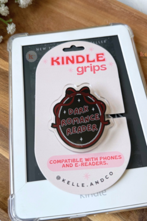 The MagSafe Dark Romance Kindle Grip, a bookish accessory compatible with phones and e-readers, sits atop its packaging—ideal for romance novel fans and followers of viral book recommendations.