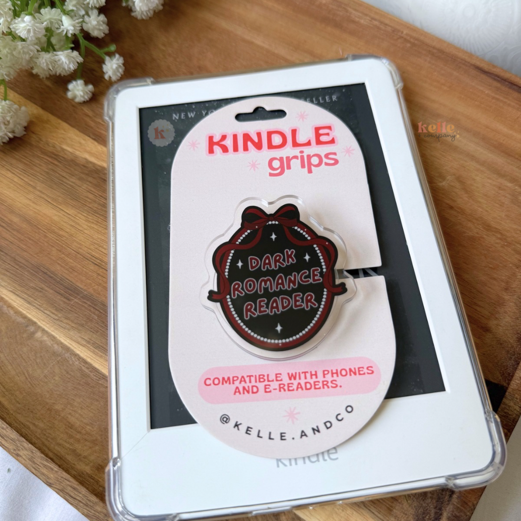 The MagSafe Dark Romance Kindle Grip, a bookish accessory compatible with phones and e-readers, sits atop its packaging—ideal for romance novel fans and followers of viral book recommendations.