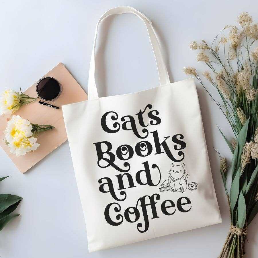 The Cats Books and Coffee Canvas Tote Bag features playful black text and a cute cat illustration with books and a coffee cup—perfect for carrying your favorite trending reads. It’s stylish, practical, and ideal for book lovers on the go.