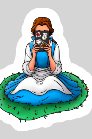 A woman in a blue and white dress sits cross-legged on grass, holding an open "Belle Beauty and Beast Kindle Reading – 3" Waterproof Bookish Sticker with Holo Overlay" in front of her face. The background is light gray with a white border.