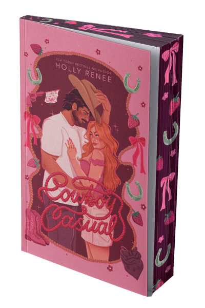 The signed special edition of Cowboy Casual features an illustrated couple—a bearded cowboy and a red haired woman—with strawberries, hearts, horseshoes, and cowboy boots decorating the pink cover.