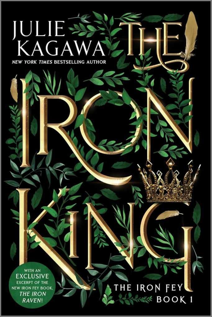 Book cover of The Iron King Special Edition (The Iron Fey) by Julie Kagawa, featuring ornate gold and green leaf designs, a gold crown, and a green sticker promoting an exclusive excerpt from The Iron Raven.