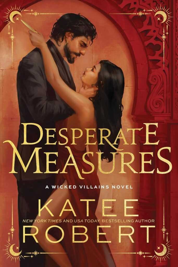 The deluxe edition cover of Desperate Measures (Wicked Villains) by Katee Robert shows a man in black and a woman in red locked in an intimate gaze, with gold text set against ornate red and gold architectural designs.