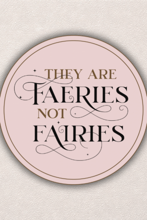 The "Faeries Not Fairies | Sticker" is a round pink sticker featuring elegant black and gold text, star-like accents, and flourishes on a textured light background, reading: “They are faeries not fairies.”.